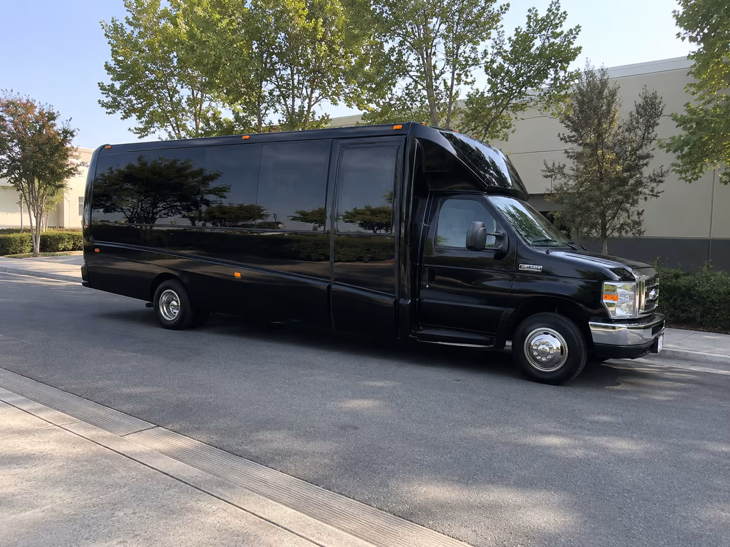 Wedding guests seated inside a party bus serving Eugene